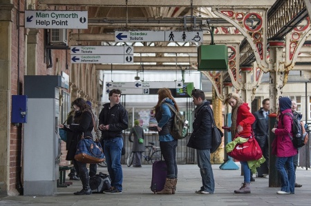 People queueing for train tickets