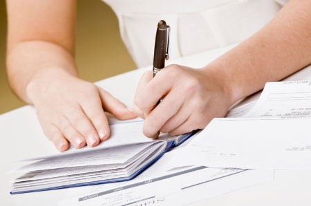 Woman writing cheque