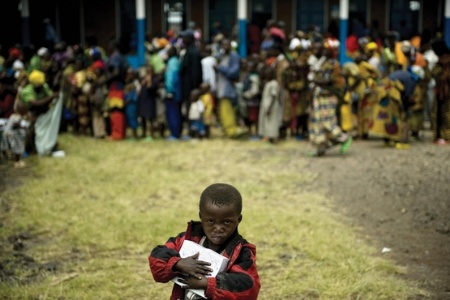 African child holding box