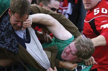 Football hooligans fighting