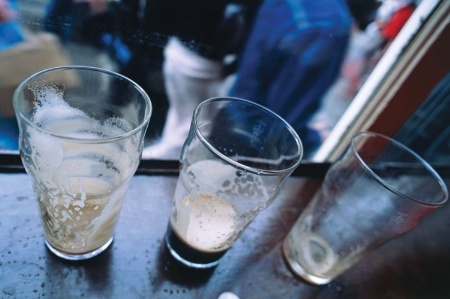 Three empty pint glasses