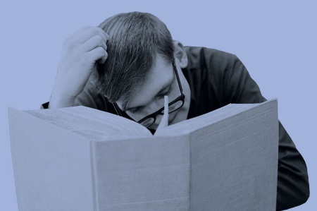 Man immersed in reading book