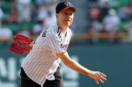 Michael Sandel throwing a baseball