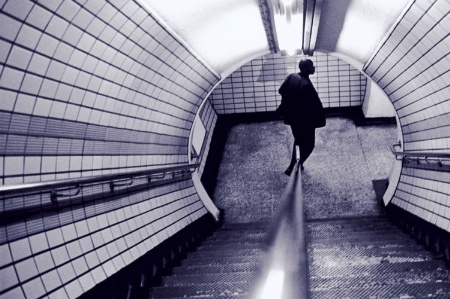 Man at bottom of tube staircase