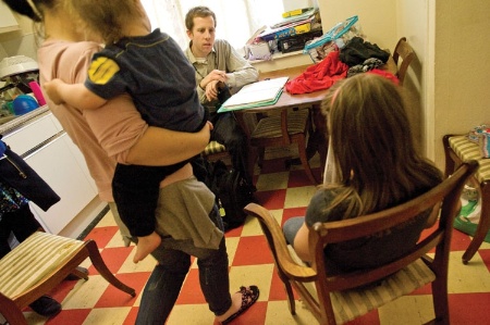 Male social worker speaking to child