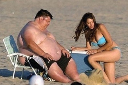 Man and woman sitting on beach