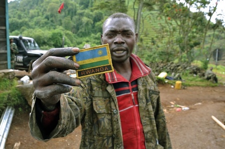 Rwandan man holding shoulder patch