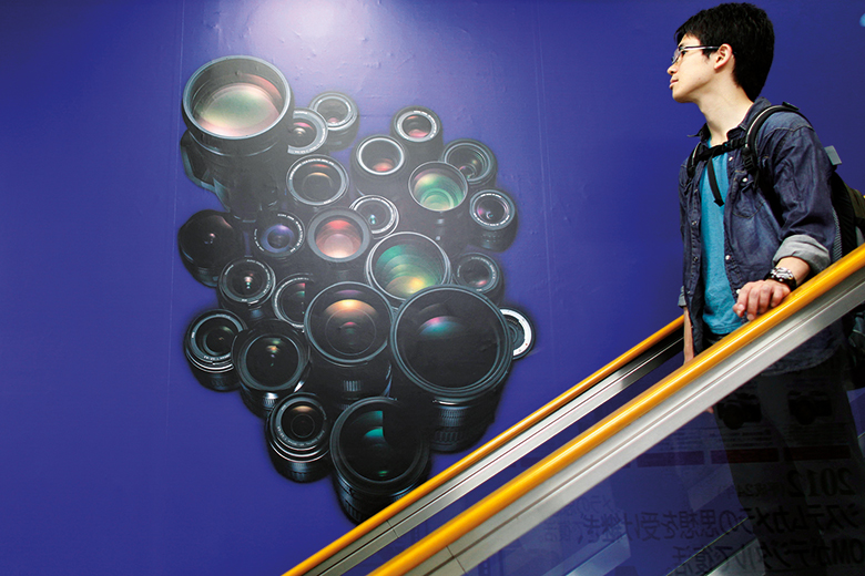 A man on an escalator in Japan