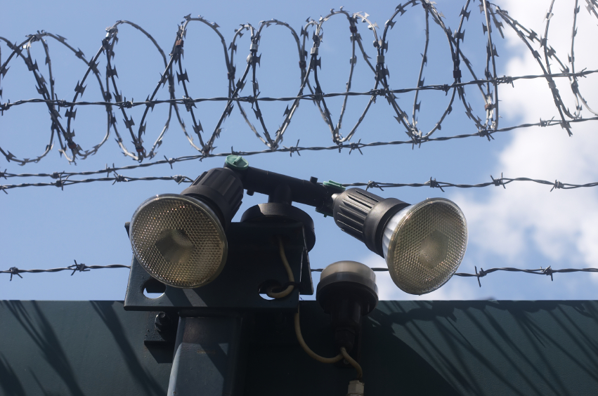 Razor wire and searchlights