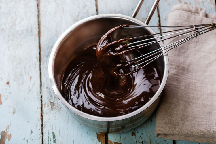 Melted chocolate being mixed in pan