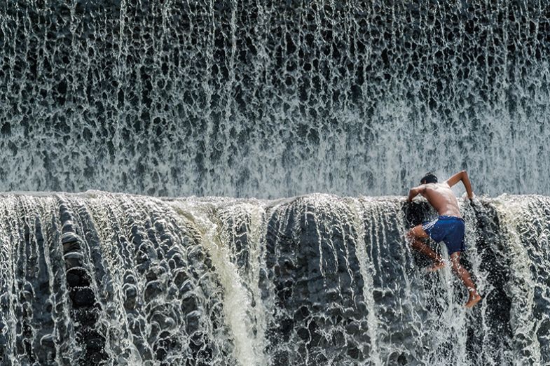 Climbing up waterfall