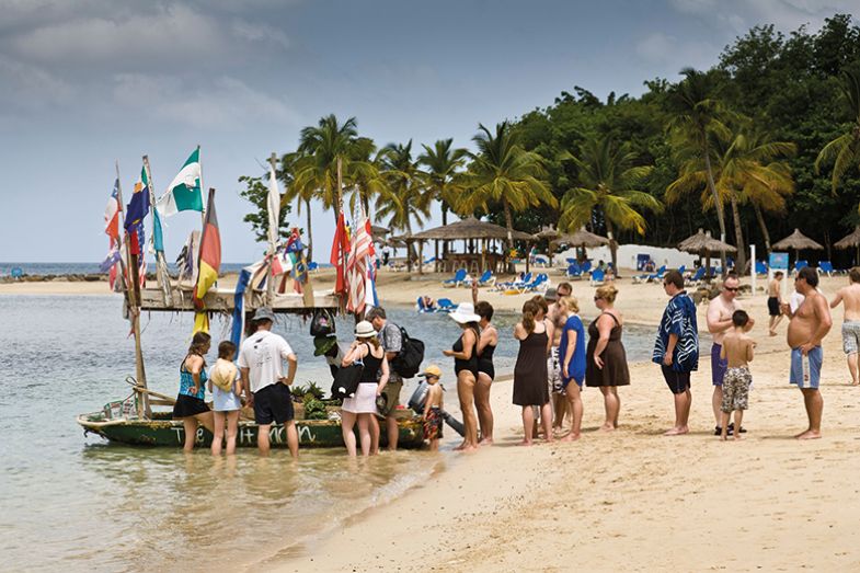 Flags and people on beach