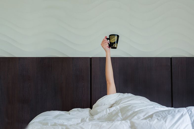 Mug of tea in bed