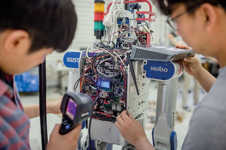 Technician working on robot