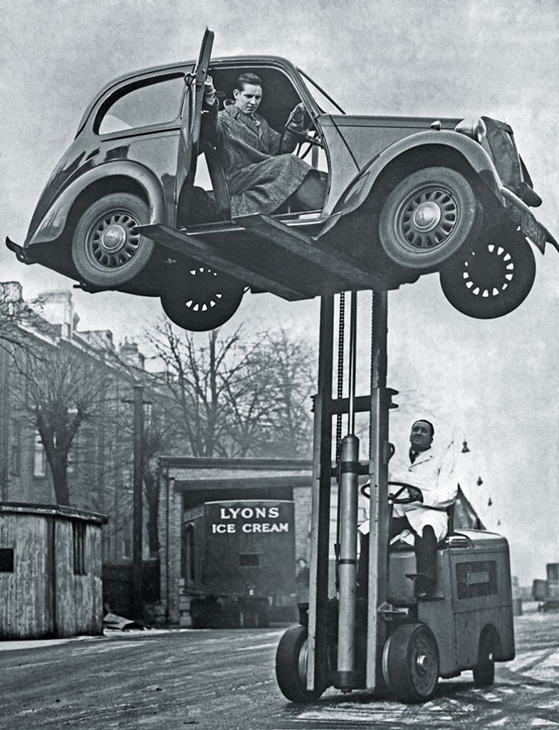 Forklift lifts car