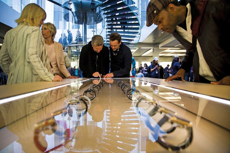 People browse wearable tech in a store