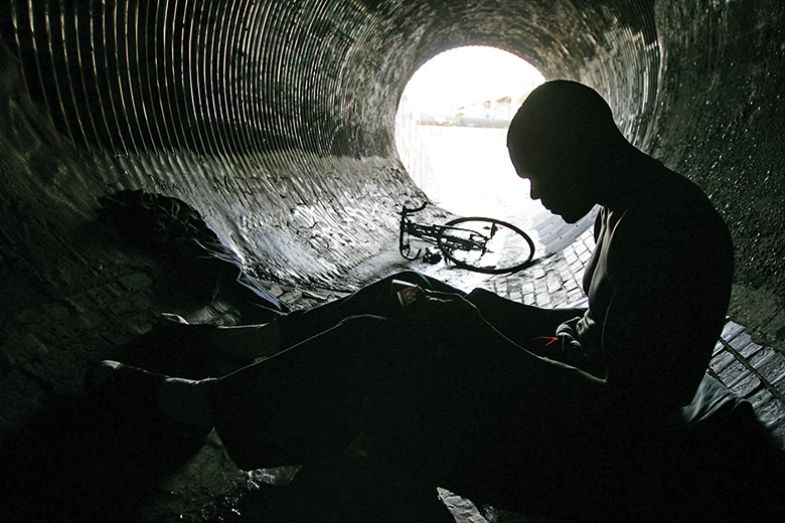 A man in a storm drain