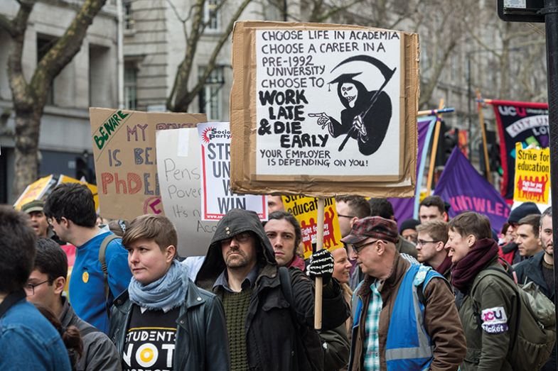 Placards of university staff during demonstration over pensions, 2018