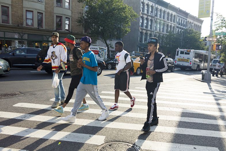 Teens crossing road