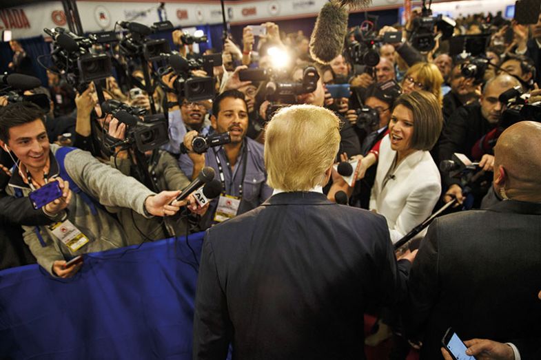 Trump surrounded by reporters