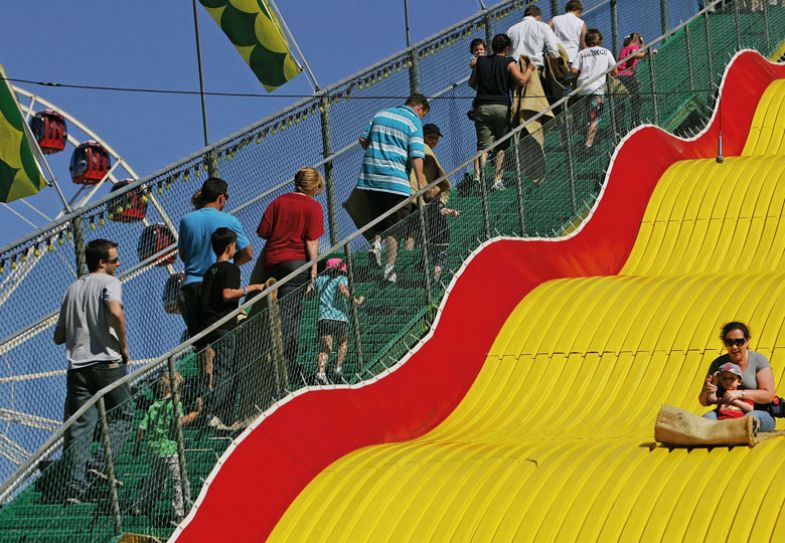 ydneysiders ride the Big Slide at the Royal Easter Show at the Sydney Showground