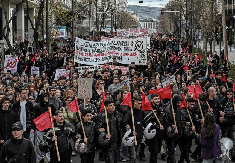 Protesters march during a students' demonstration in central Athens