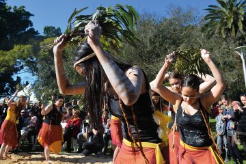 Indigenous Australian performers hold a smoking ceremony 