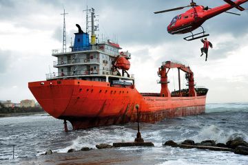 Montage: a helicopter drops an academic on board a stricken ship