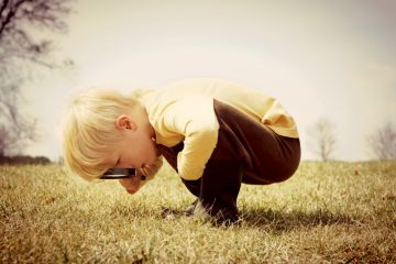 Boy with magnifying glass