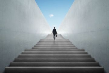 Businessman climbing stairs