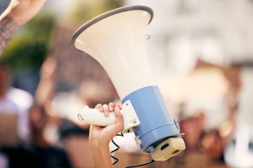 A megaphone held aloft, symbolising free speech