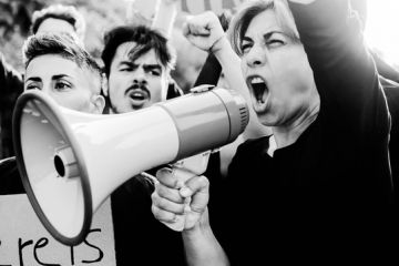 A woman with a megaphone, symbolising free speech