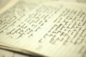 Handwritten essay on table