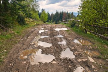 A muddy road in the countryside