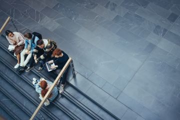 Some students gather on some steps