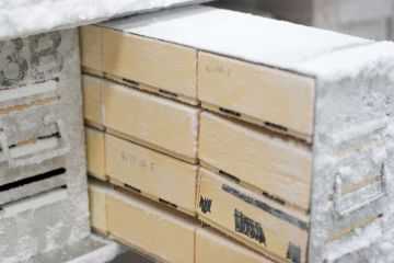 Boxes in a freezer drawer that is pulled out