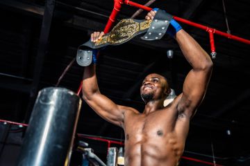 A boxer holds aloft his Lonsdale belt