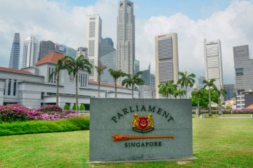 Singapore, Singapore - July 3, 2015: The facade of Singapore Parliament building in front of Singapore downtown. The Parliament and the President jointly make up the legislature of Singapore.