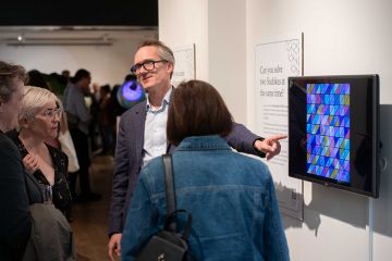 John Armstrong with guests at the It All Adds Up exhibition