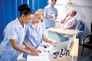 Nurses looking at chart