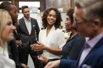 People standing and talking at a conference