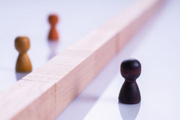 Black and white chess pieces, symbolising racism