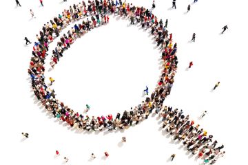 Large group of people in the shape of a magnifying glass, symbolising shared vision