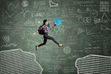 Student in front of blackboard