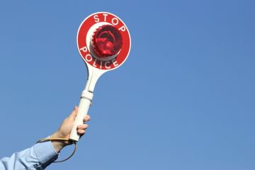 A stop police sign, symbolising misconduct rules