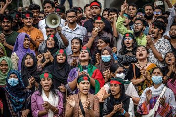 Students chant slogans as they protest to demand accountability and trial against Bangladesh's ousted Prime Minister Sheikh Hasina, near Dhaka University in the capital on August 12, 2024