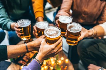 Toasting with glasses of beer