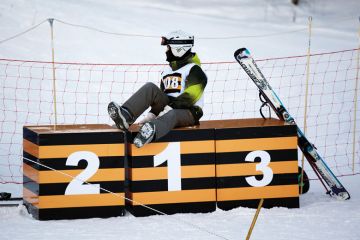 Young athlete resting on podium to illustrate TEF appeals ‘won’t be resolved until the end of the year’