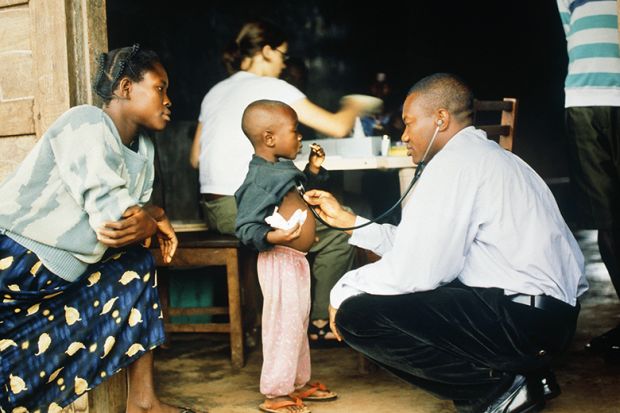 Doctor examines young patient