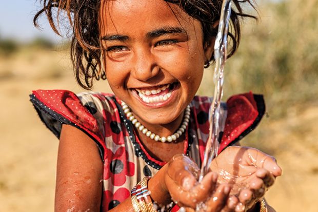 A girl washing her hands